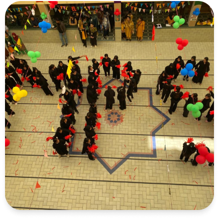 Aerial view of courtyard student formation and celebration balloons
