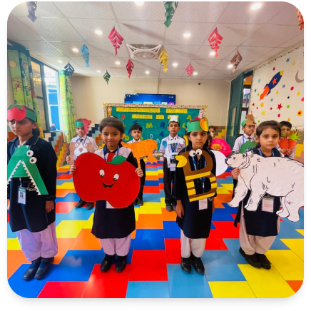 Montessori students displaying alphabet props and interactive learning materials
