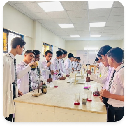 Secondary students conducting chemistry experiment in science laboratory